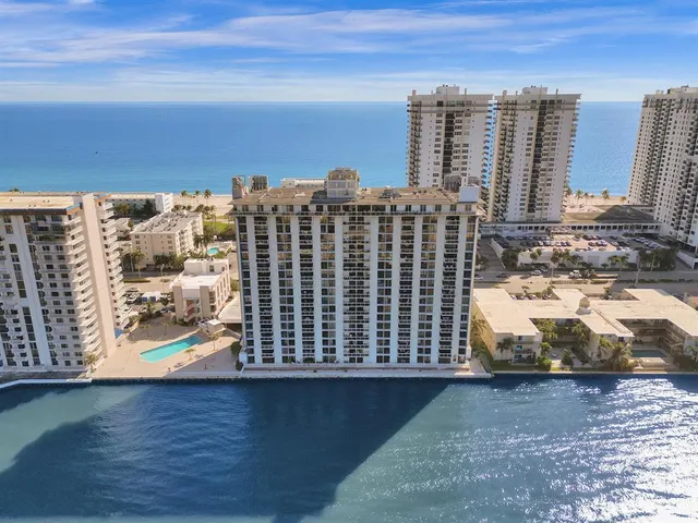 a front view of a building with outdoor seating