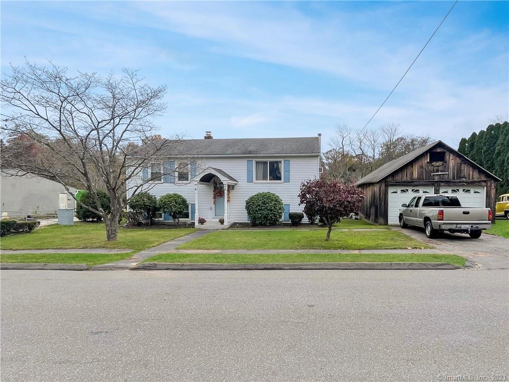 45 Millbrook Road Middletown, CT 06457 - Photo 1 of 1 a house with a yard and a car parked in front of it
