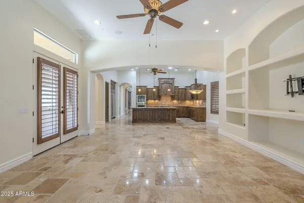 a large kitchen with a table and chairs