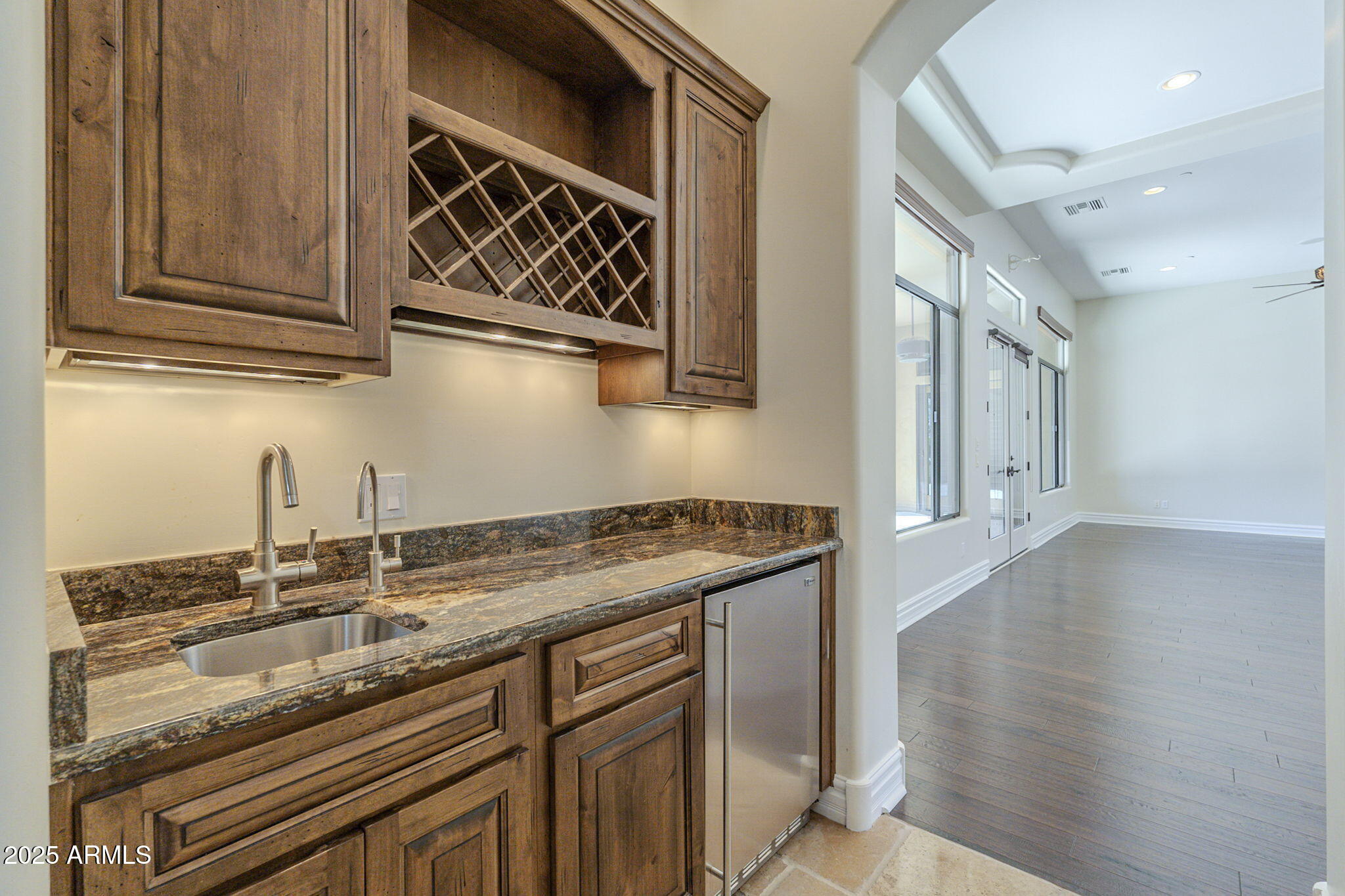 15135 East Monument Road Scottsdale, AZ 85262 - Photo 18 of 65 a kitchen with stainless steel appliances granite countertop a sink and cabinets