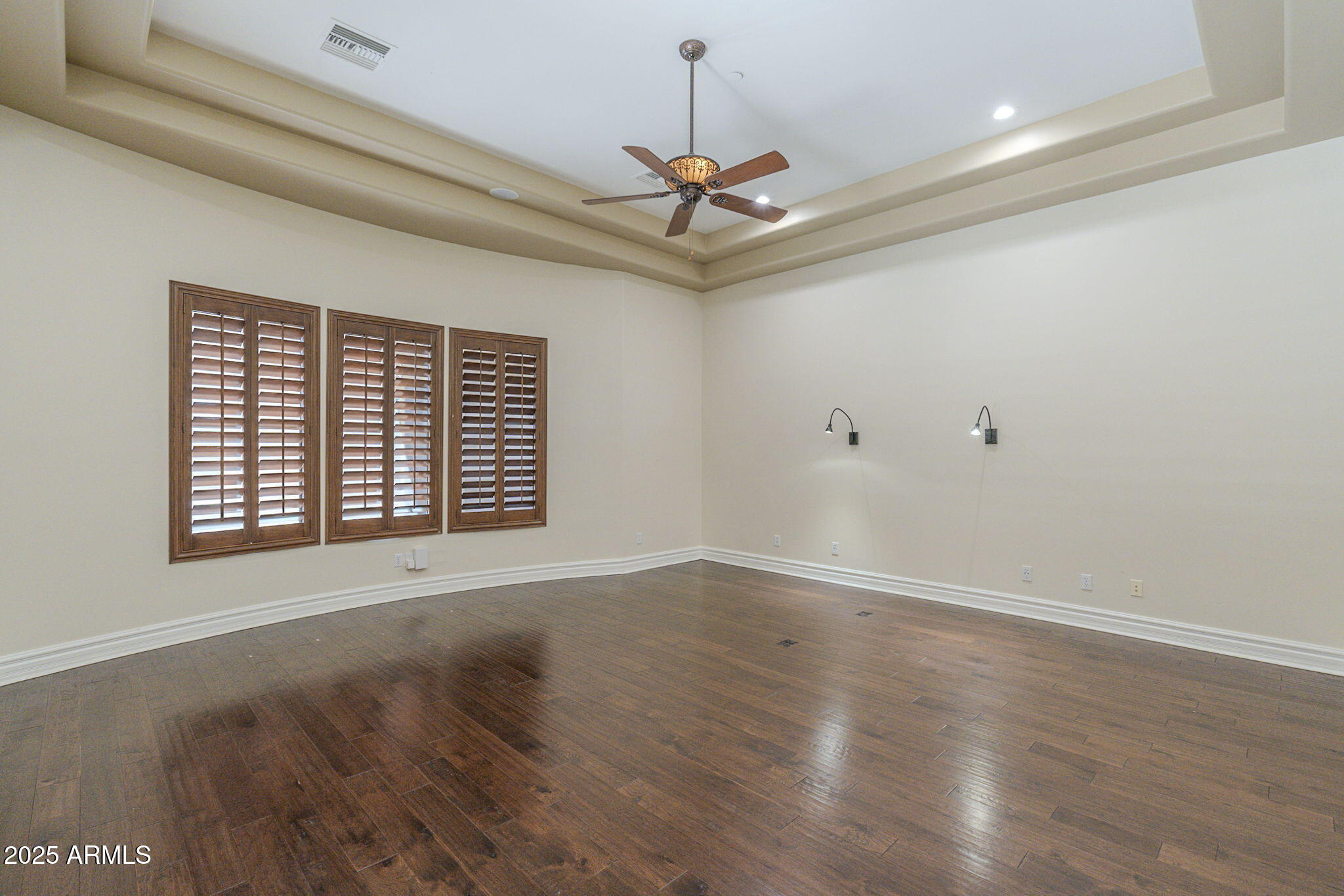 15135 East Monument Road Scottsdale, AZ 85262 - Photo 19 of 65 a view of an empty room with wooden floor and a window