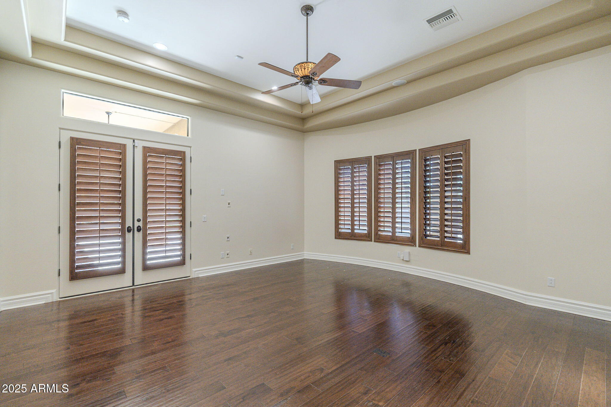 15135 East Monument Road Scottsdale, AZ 85262 - Photo 21 of 65 a view of an empty room with wooden floor and a window