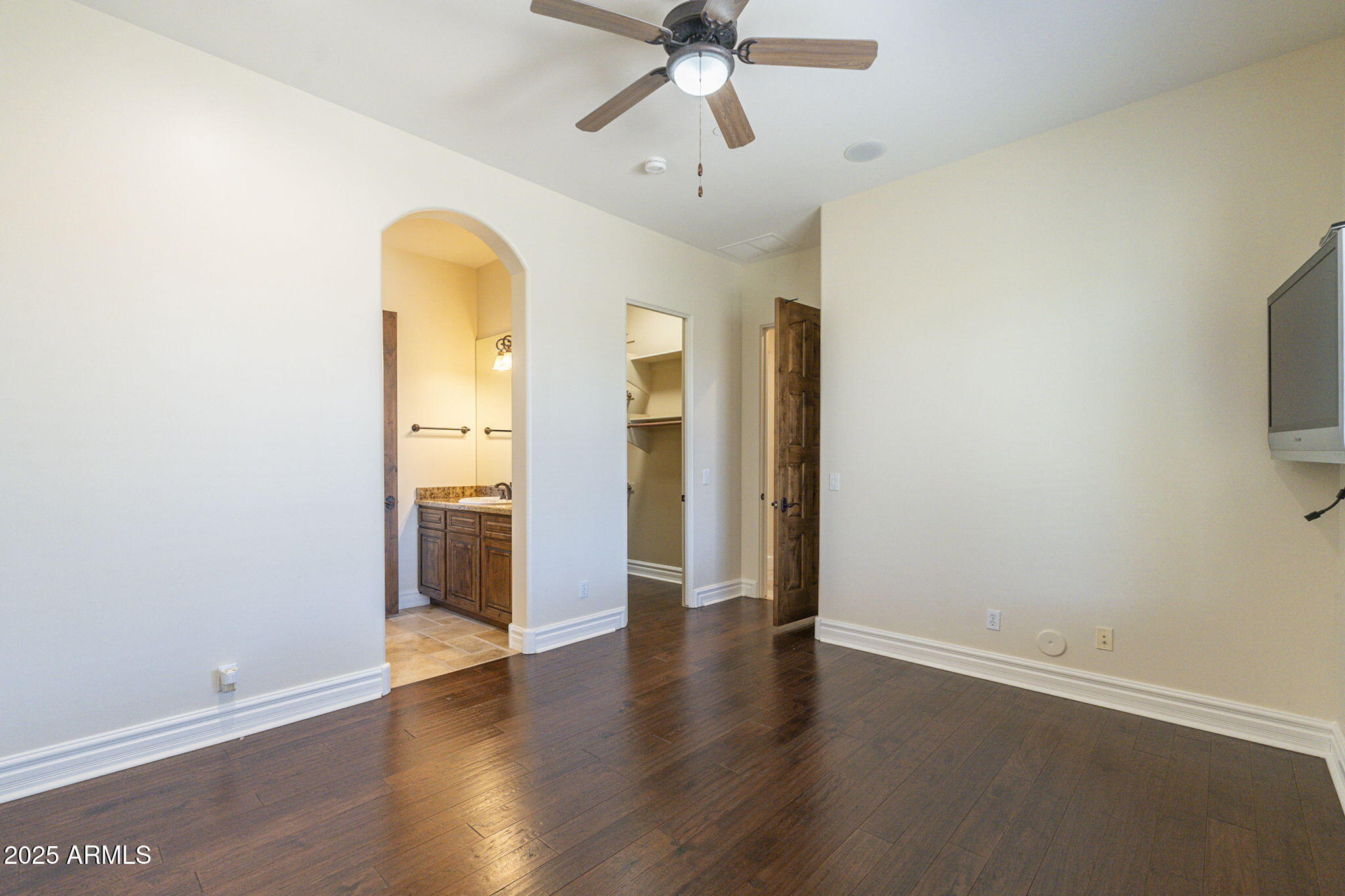 15135 East Monument Road Scottsdale, AZ 85262 - Photo 29 of 65 an empty room with wooden floor and a ceiling fan