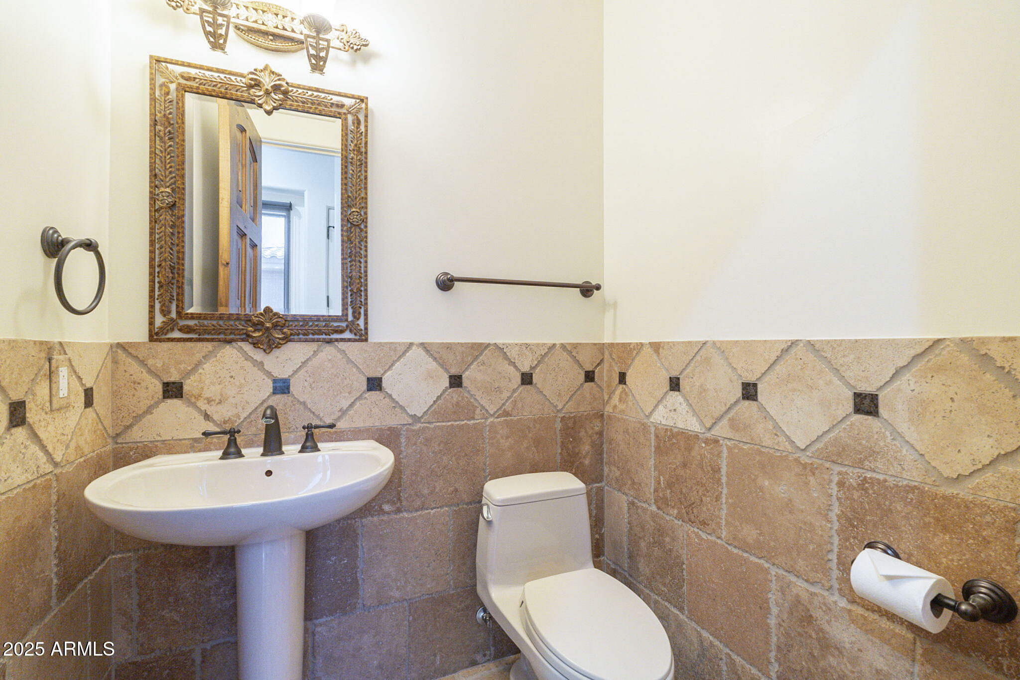 15135 East Monument Road Scottsdale, AZ 85262 - Photo 34 of 65 a bathroom with a sink a toilet and mirror