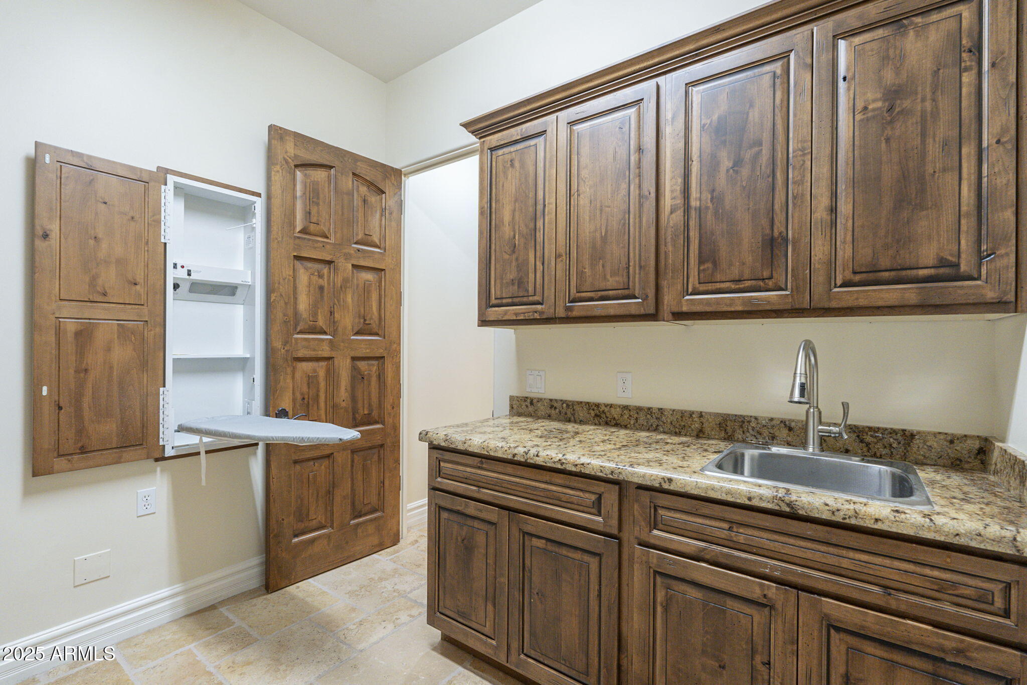 15135 East Monument Road Scottsdale, AZ 85262 - Photo 36 of 65 a kitchen with stainless steel appliances granite countertop a sink refrigerator and cabinets