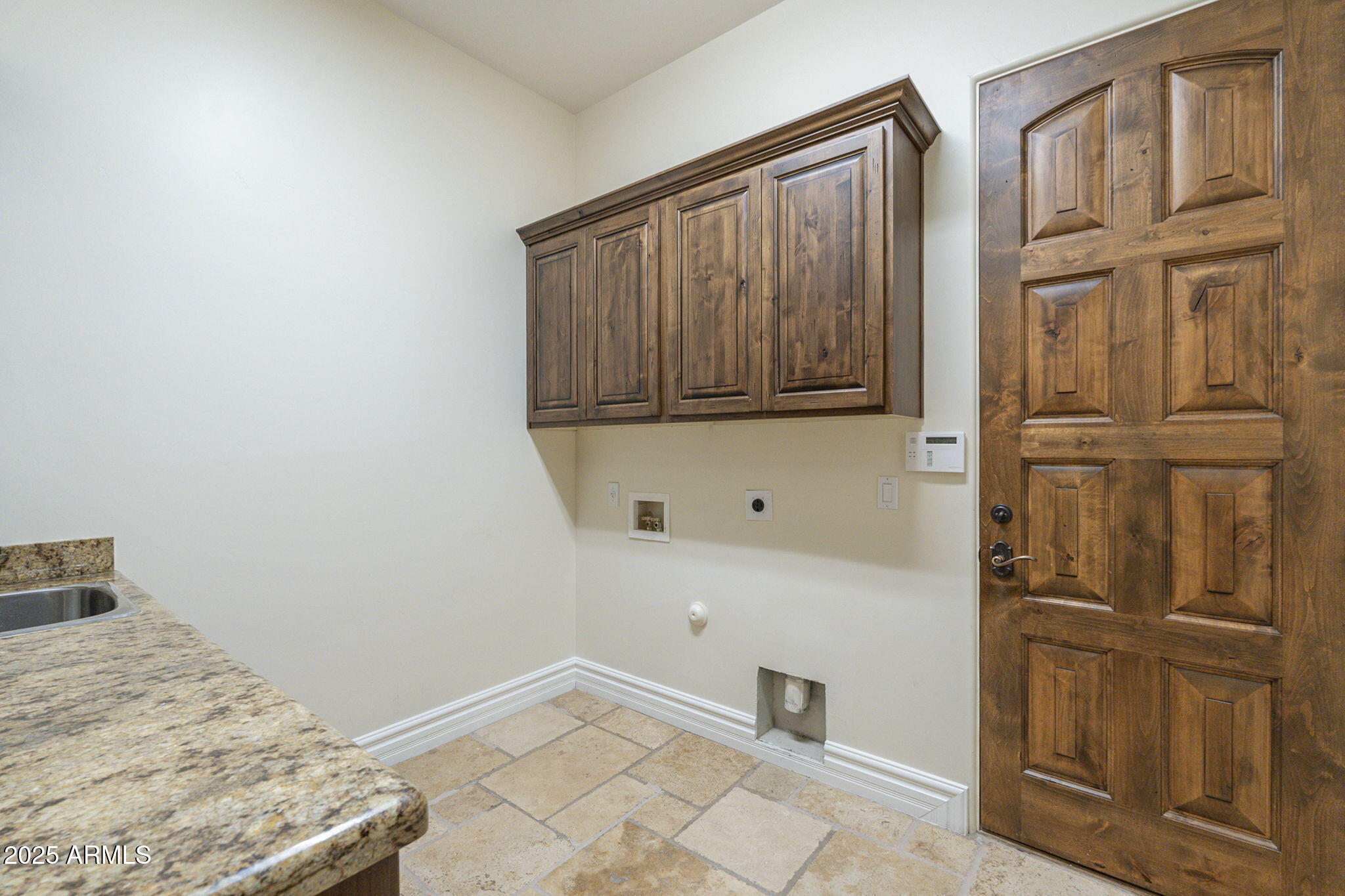 15135 East Monument Road Scottsdale, AZ 85262 - Photo 37 of 65 a bedroom with a bed and cabinets