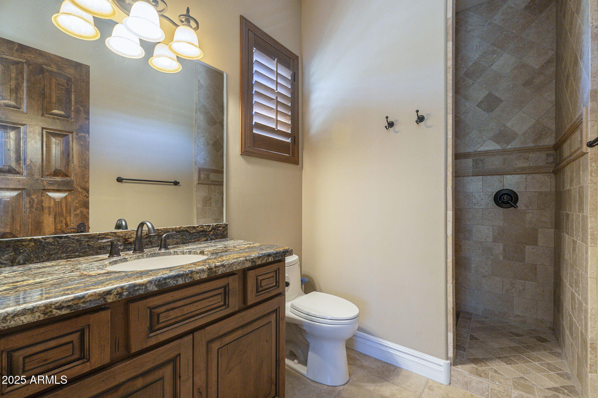 15135 East Monument Road Scottsdale, AZ 85262 - Photo 49 of 65 a bathroom with a granite countertop sink a toilet and a mirror
