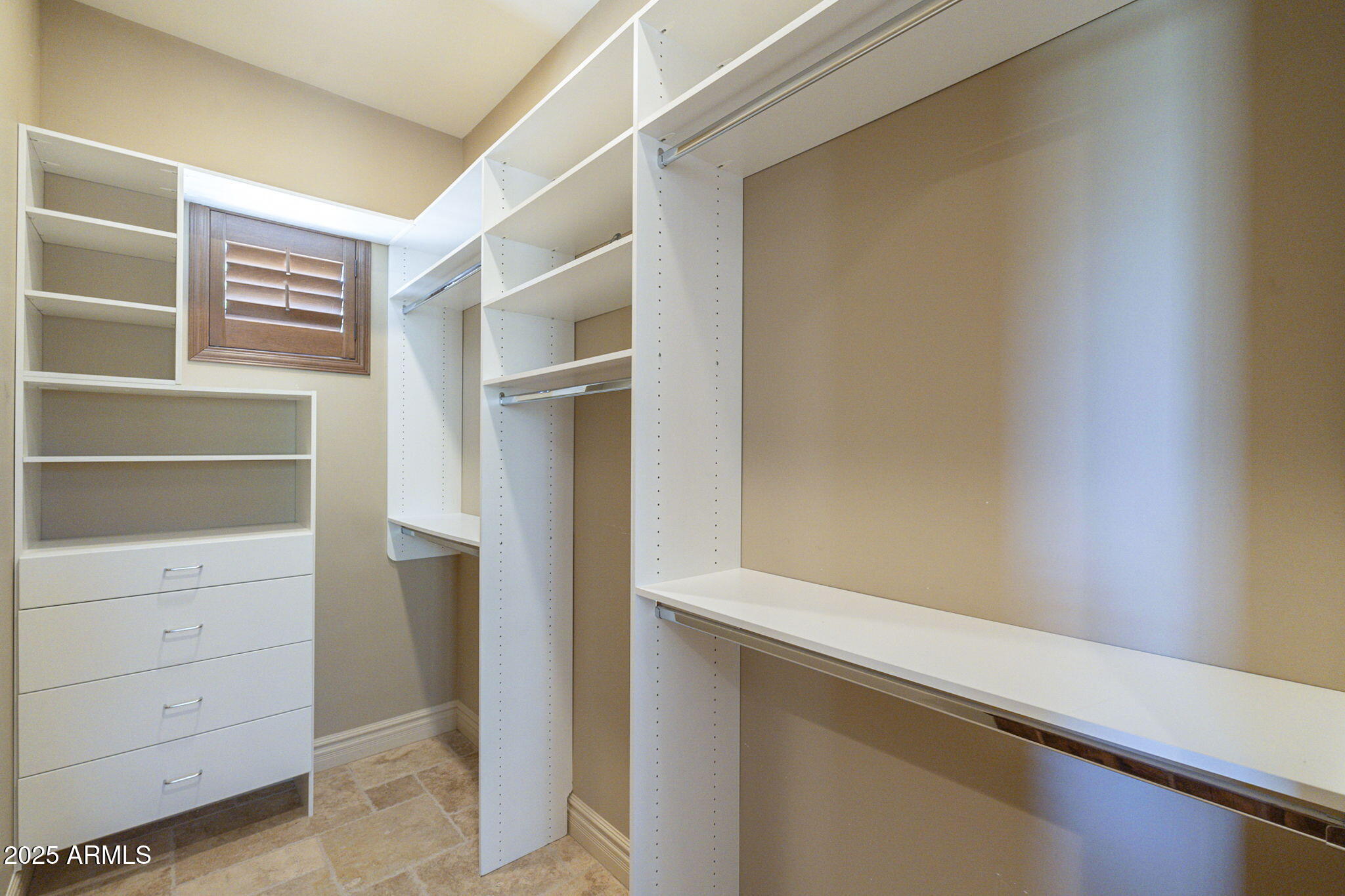 15135 East Monument Road Scottsdale, AZ 85262 - Photo 50 of 65 a view of walk in closet with empty racks