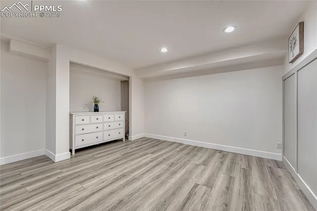 a front view of a house with a garden and plants