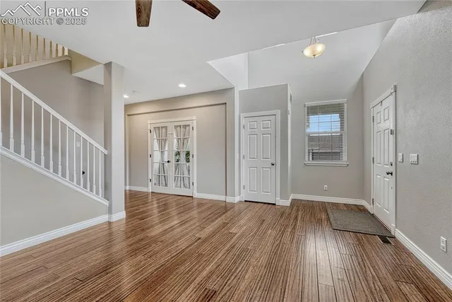 a spacious bedroom with a bed furniture and a window