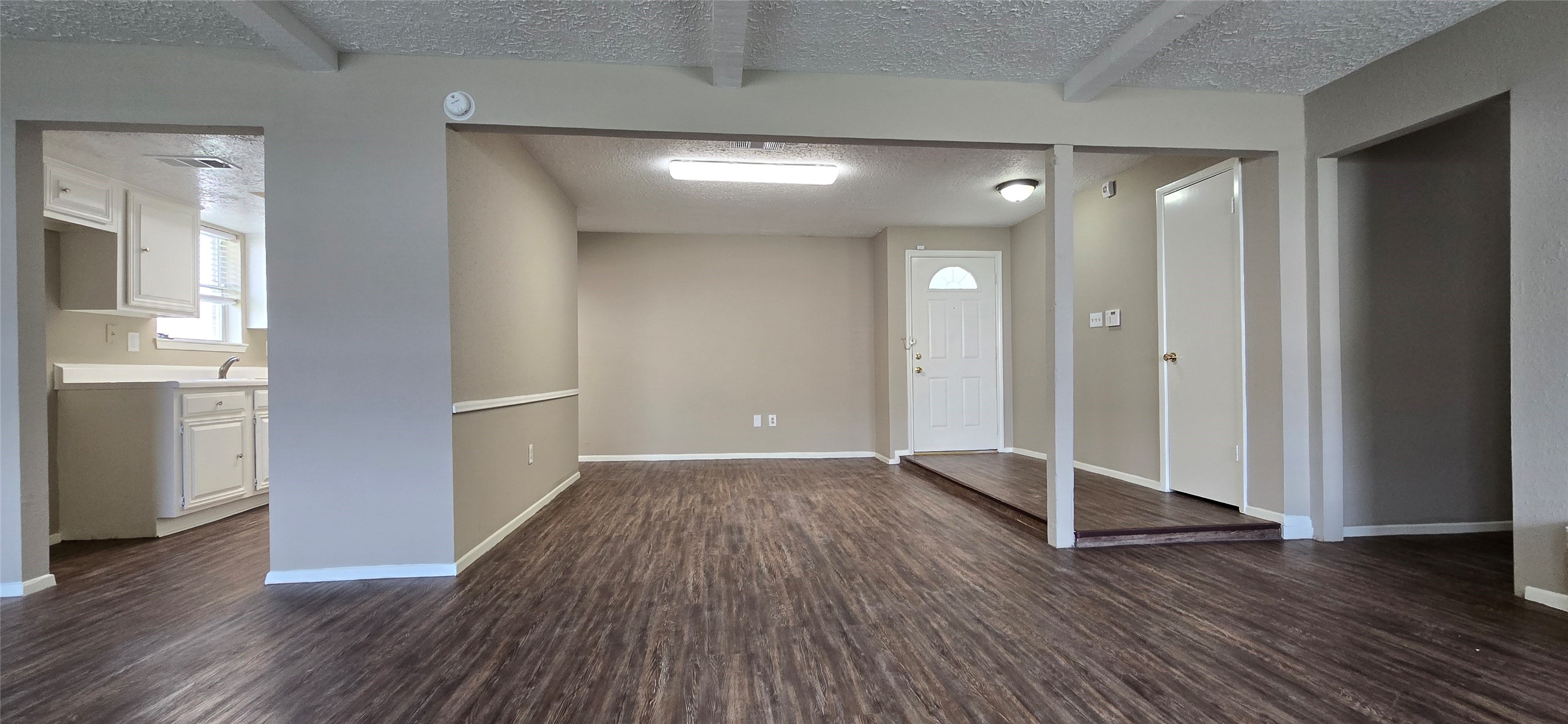 23019 Tree Bright Lane Spring, TX 77373 - Photo 3 of 20 View of the front door entry and dining area. Kitchen to the left. Hallway to bedrooms on the right. Convenient coat/storage closet on the right.
