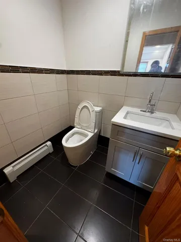 a bathroom with a sink toilet and vanity