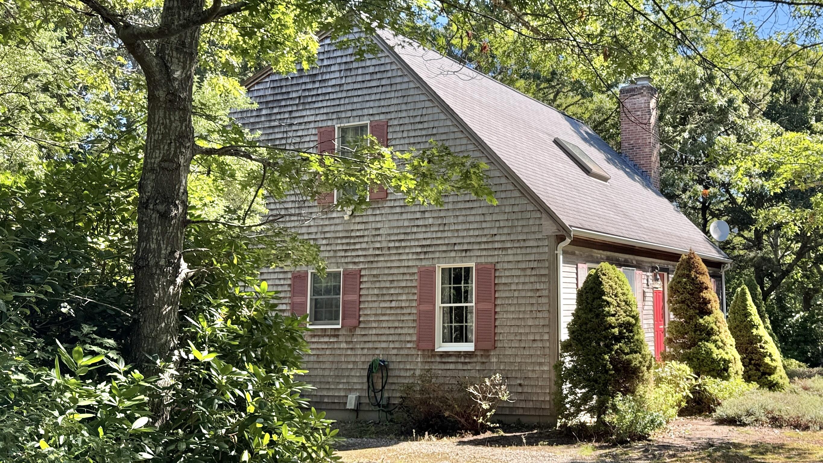 a view of a house with a tree