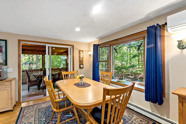 a view of a dining room with furniture window and outside view