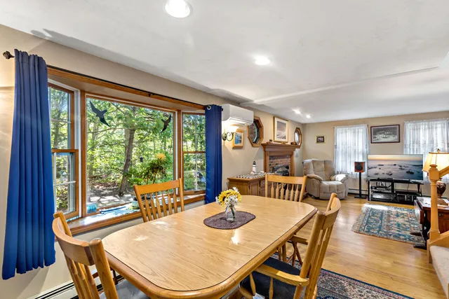 a view of a dining room with furniture window and outside view
