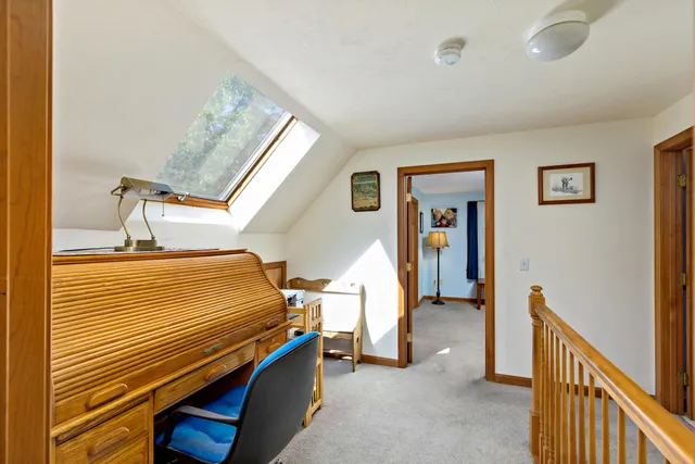 a bedroom with furniture and window