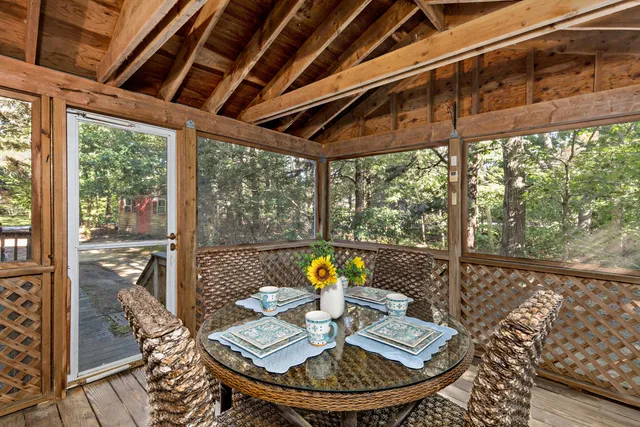 a view of balcony with wooden floor