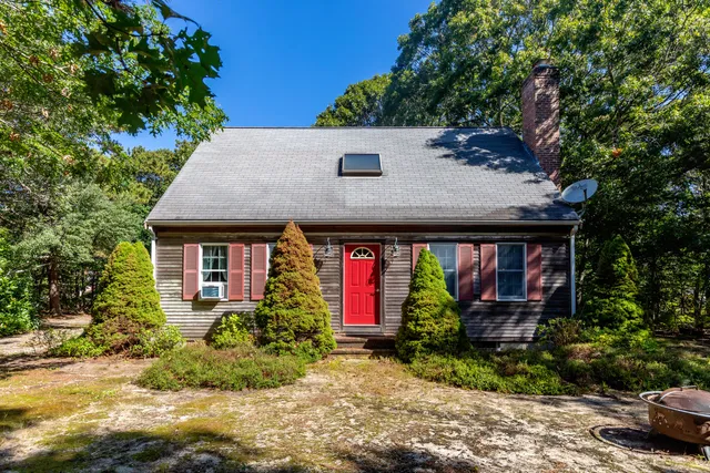 a front view of a house with yard