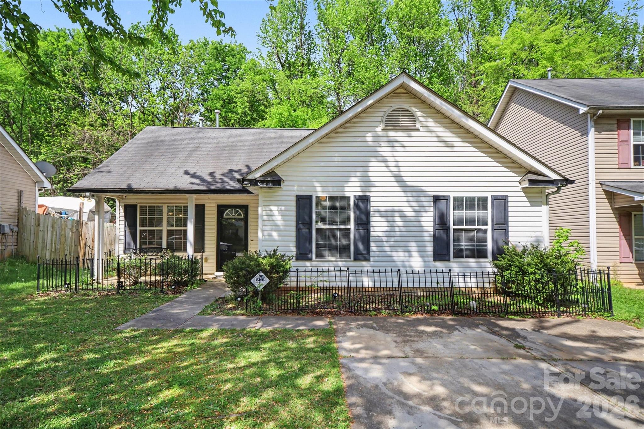 a front view of house with yard outdoor seating and green space