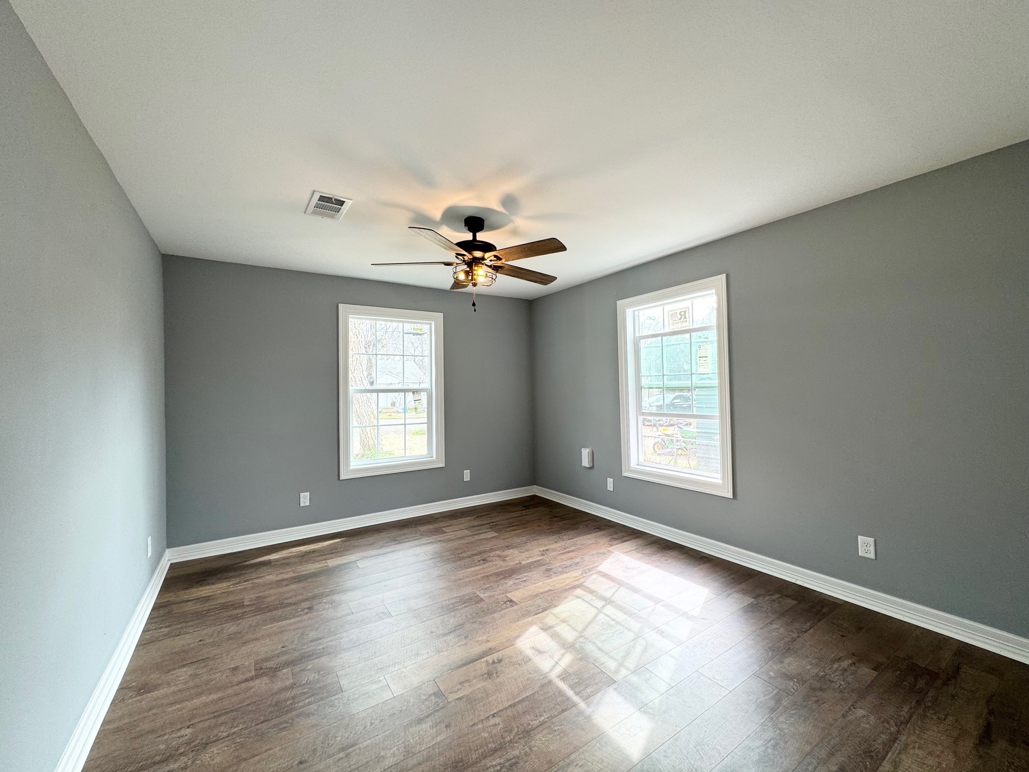 409 South 9th Street Crockett, TX 75835 - Photo 14 of 19 a view of an empty room with wooden floor and a window