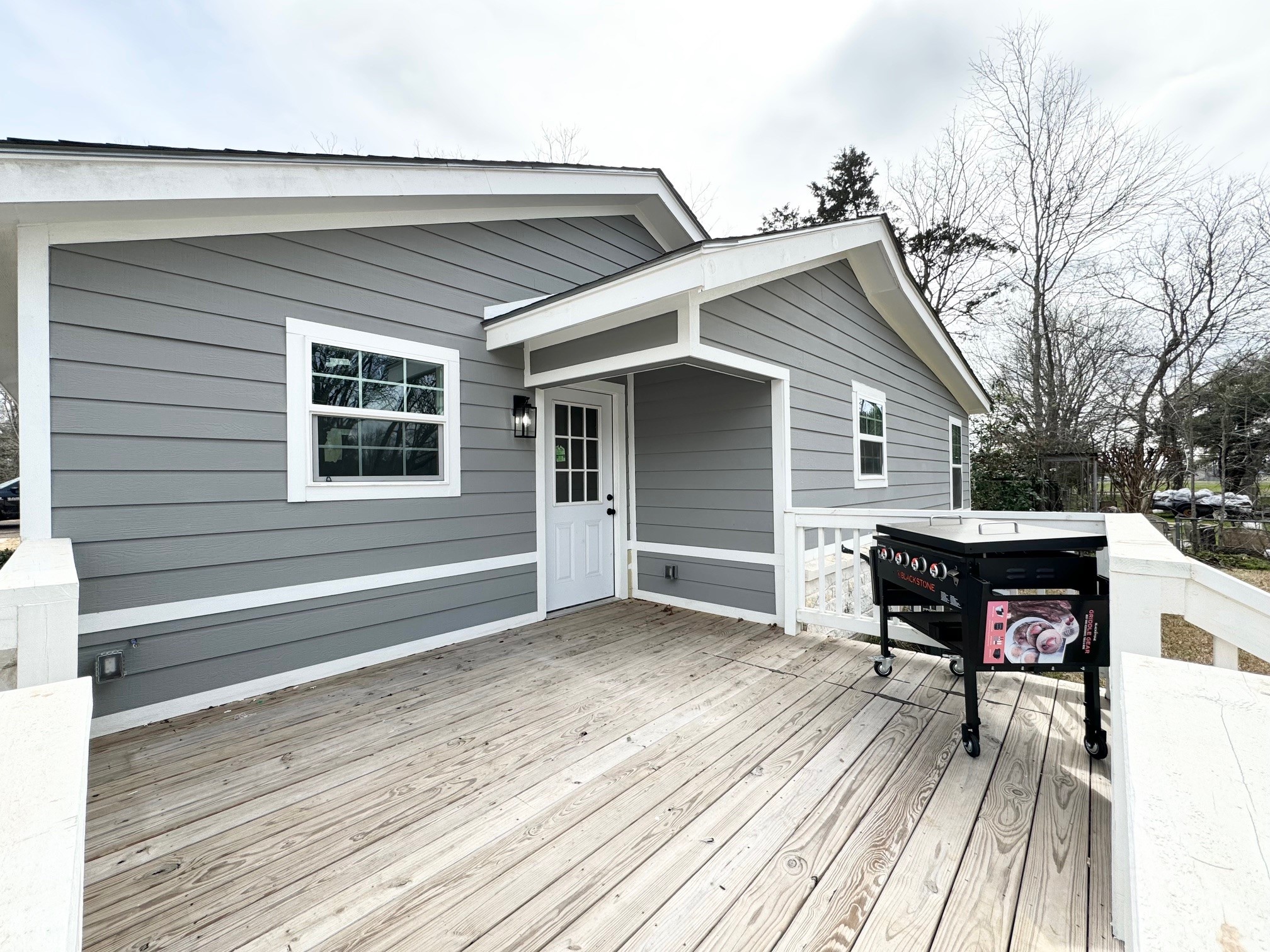 409 South 9th Street Crockett, TX 75835 - Photo 18 of 19 a view of house with deck outdoor seating and yard in the back