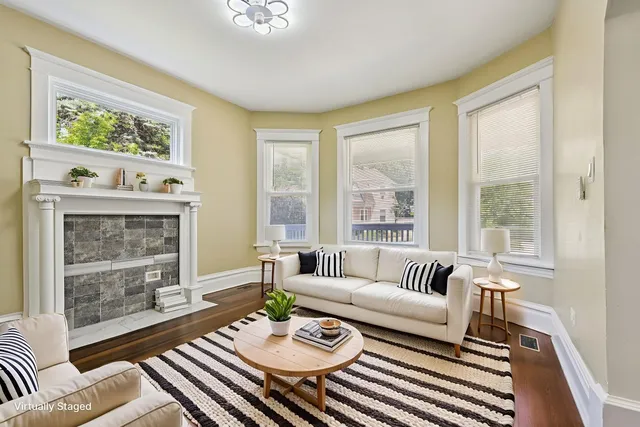 a living room with furniture and a fireplace