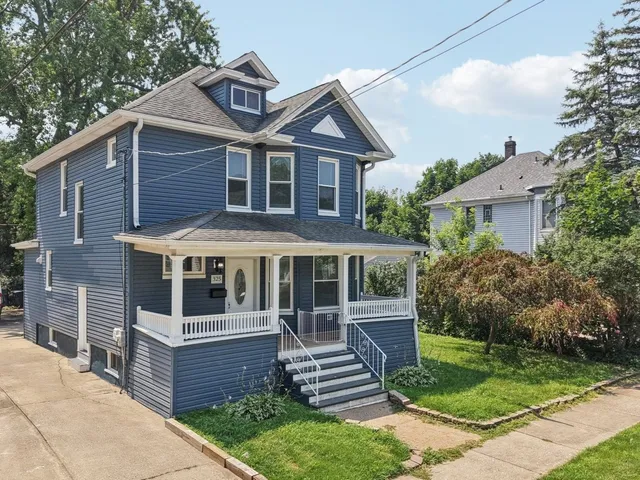 a front view of a house with a yard