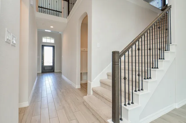 a kitchen with stainless steel appliances a sink stove and cabinets