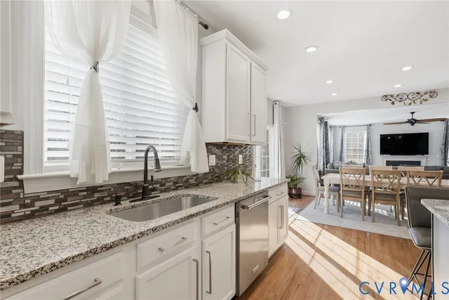 a kitchen with a sink and a large window