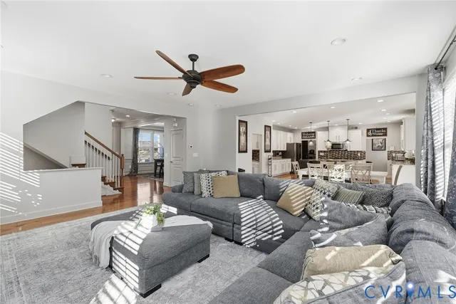 a living room with furniture a fireplace and a window