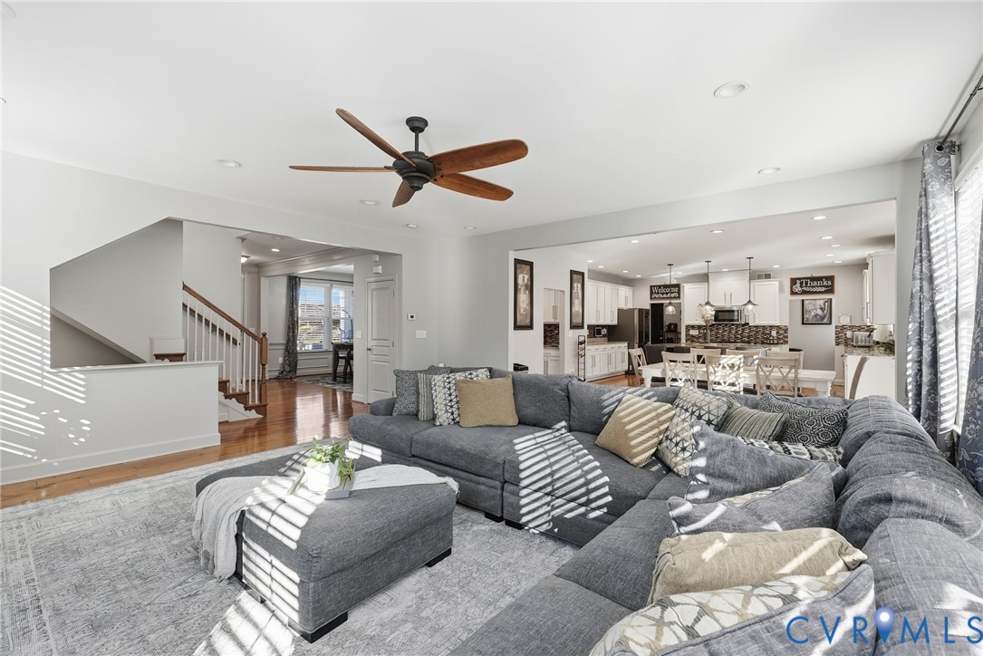 10887 Monocacy Way Manassas, VA 20112 - Photo 19 of 48 Living room featuring stairs, wood finished floors