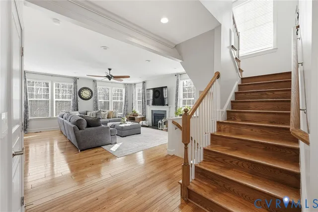 a living room with furniture and wooden floor