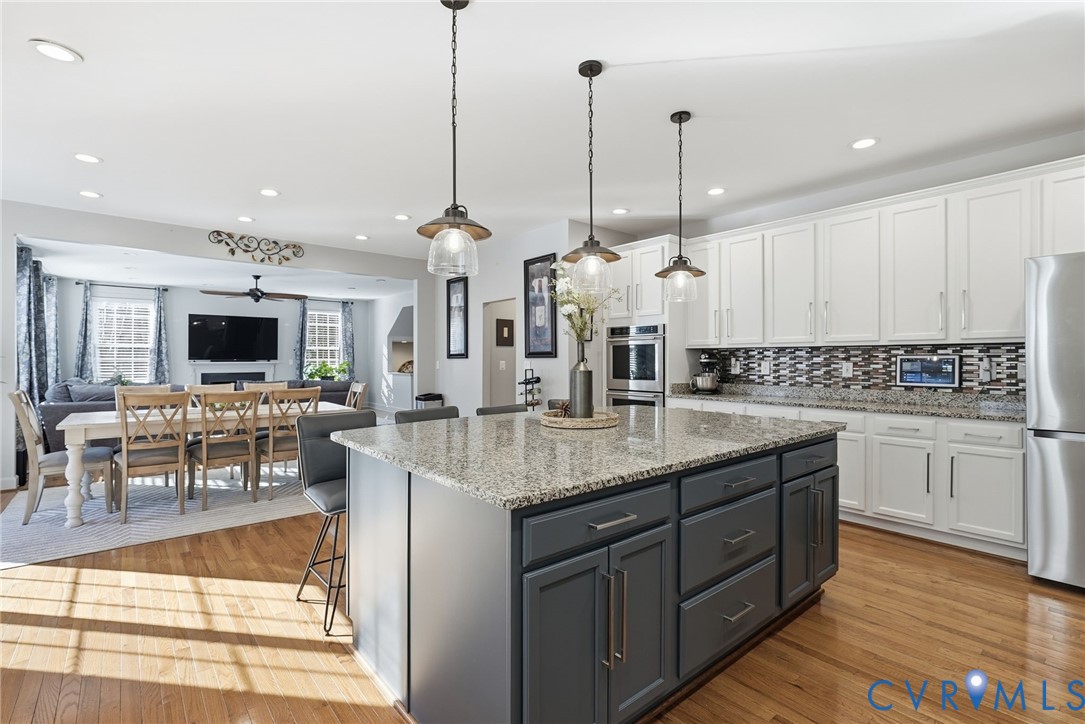 10887 Monocacy Way Manassas, VA 20112 - Photo 9 of 48 Chefs Kitchen with modern white cabinets, a breakf