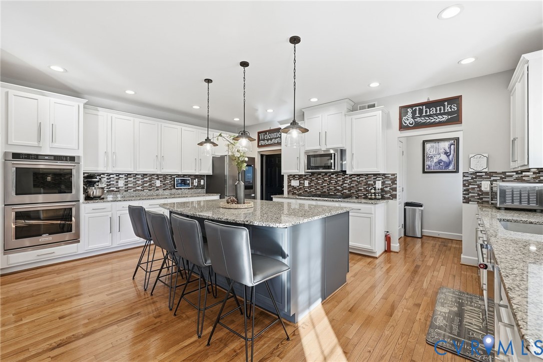10887 Monocacy Way Manassas, VA 20112 - Photo 10 of 48 Chefs Kitchen with modern white cabinets, a breakf