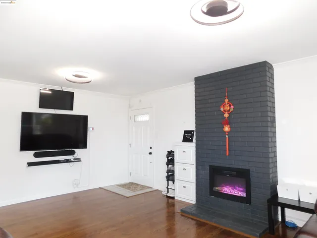 a kitchen with stainless steel appliances granite countertop a refrigerator a stove a sink and a microwave