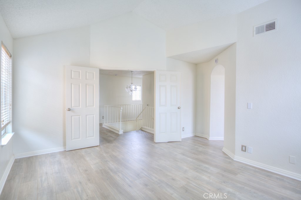 13006 Parkview Drive Baldwin Park, CA 91706 - Photo 20 of 46 an empty room with wooden floor and windows