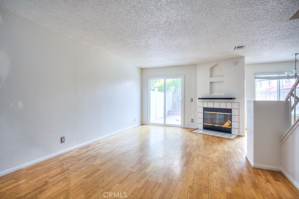 13006 Parkview Drive Baldwin Park, CA 91706 - Photo 2 of 46 a view of an empty room with a fireplace and a window