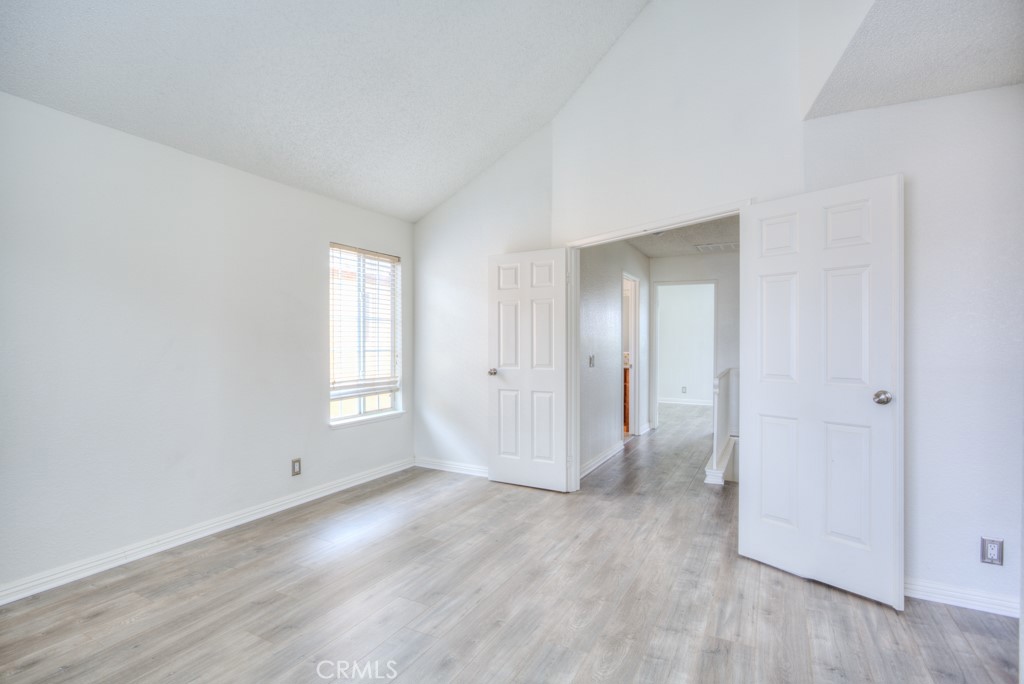 13006 Parkview Drive Baldwin Park, CA 91706 - Photo 21 of 46 an empty room with wooden floor and windows