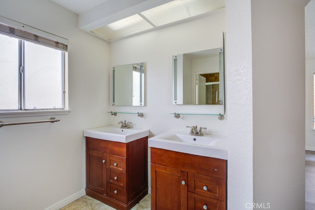 13006 Parkview Drive Baldwin Park, CA 91706 - Photo 25 of 46 a bathroom with a sink and a mirror