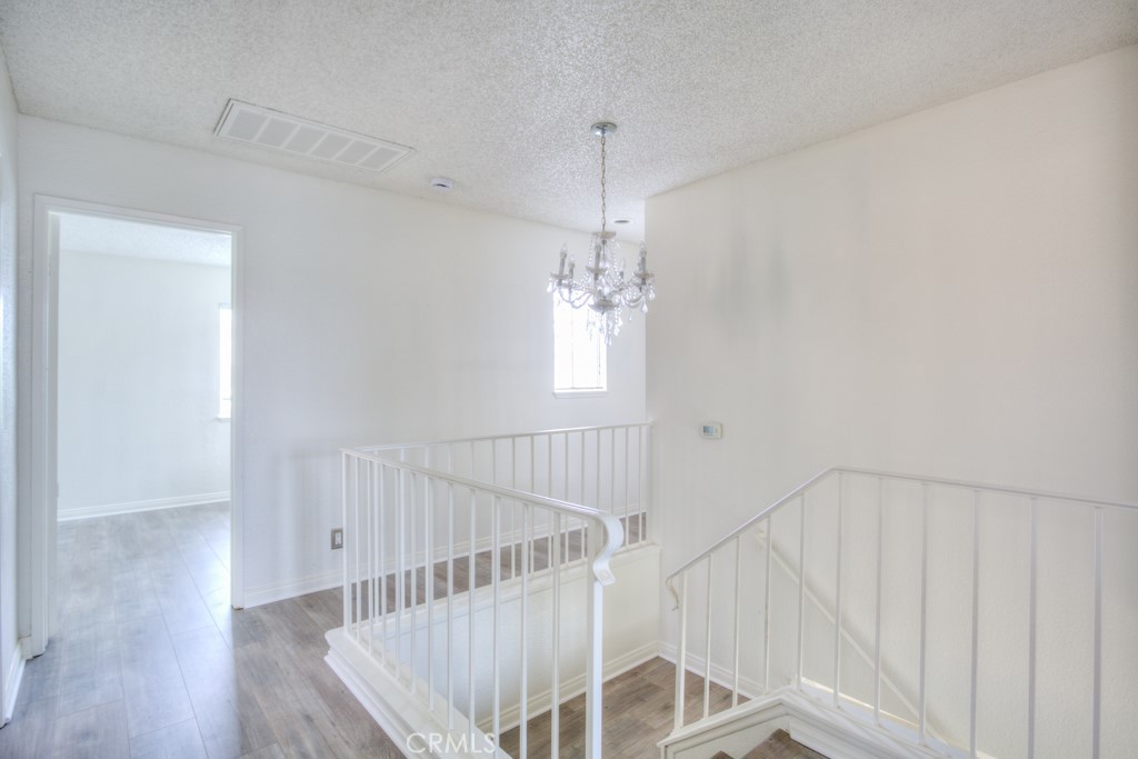 13006 Parkview Drive Baldwin Park, CA 91706 - Photo 27 of 46 a view of a room with wooden floor and staircase