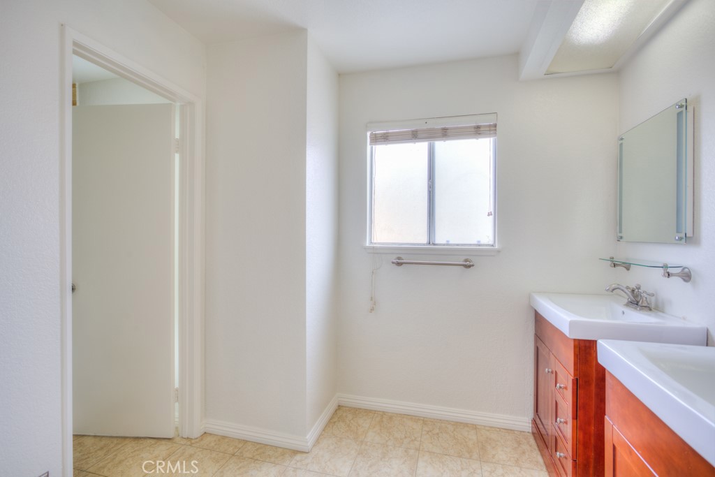 13006 Parkview Drive Baldwin Park, CA 91706 - Photo 37 of 46 a bathroom with a sink and a mirror
