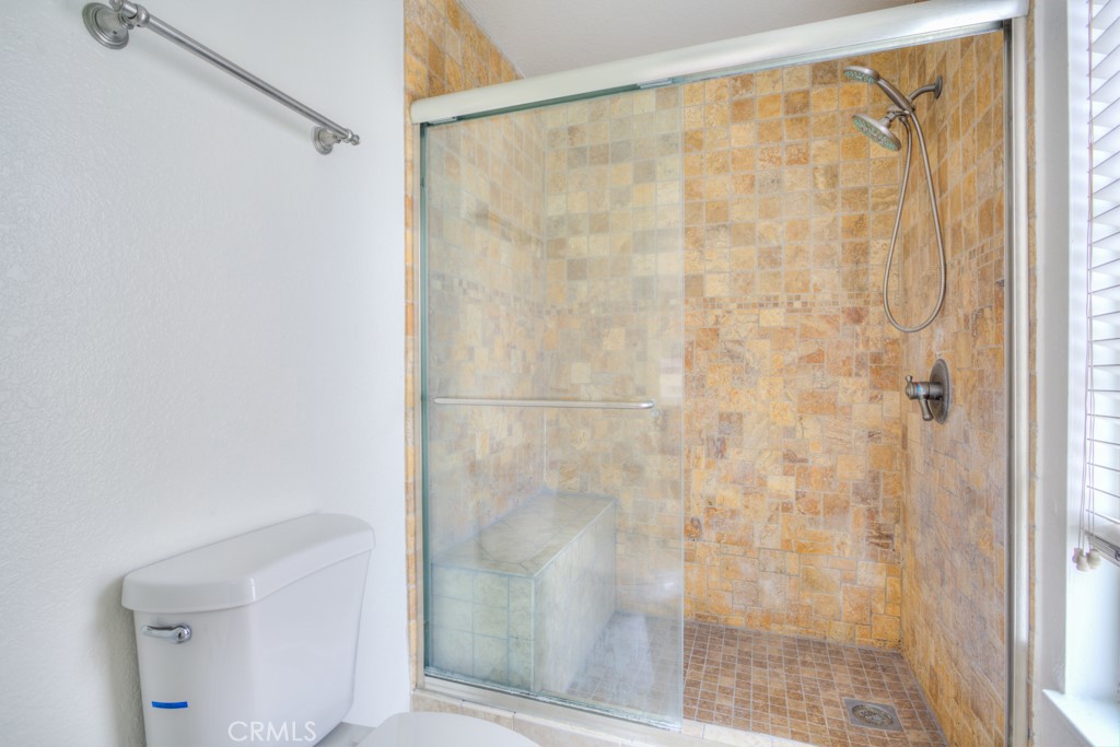 13006 Parkview Drive Baldwin Park, CA 91706 - Photo 39 of 46 a bathroom with a glass shower door