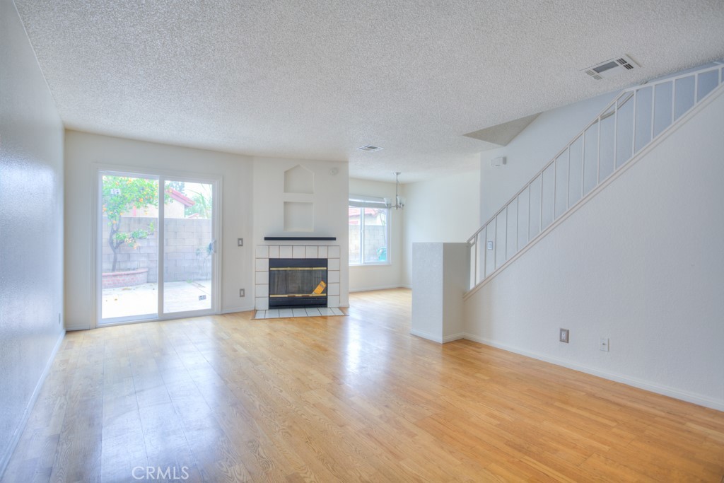 13006 Parkview Drive Baldwin Park, CA 91706 - Photo 4 of 46 a view of empty room with wooden floor and fireplace