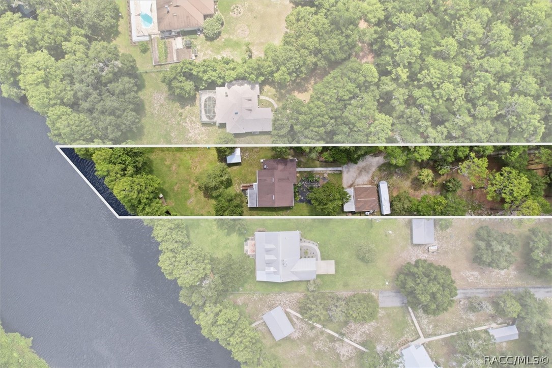 4099 West Ridge Court Dunnellon, FL 34433 - Photo 8 of 49 Another aerial view of property. showing all the space for your workshop, shed and RV parking and Hook Up! One of the most perfect location on the water in my opinion! Check it out? See if you agree?
