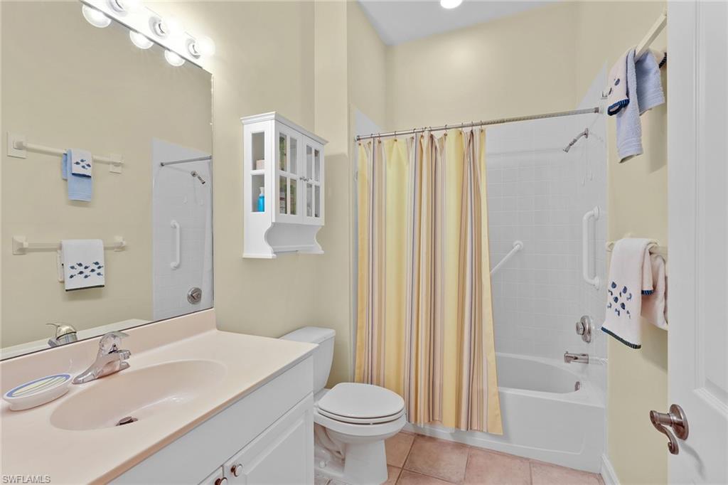 795 Bentwater Circle, Unit 203 Naples, FL 34108 - Photo 18 of 33 a bathroom with a sink toilet and shower