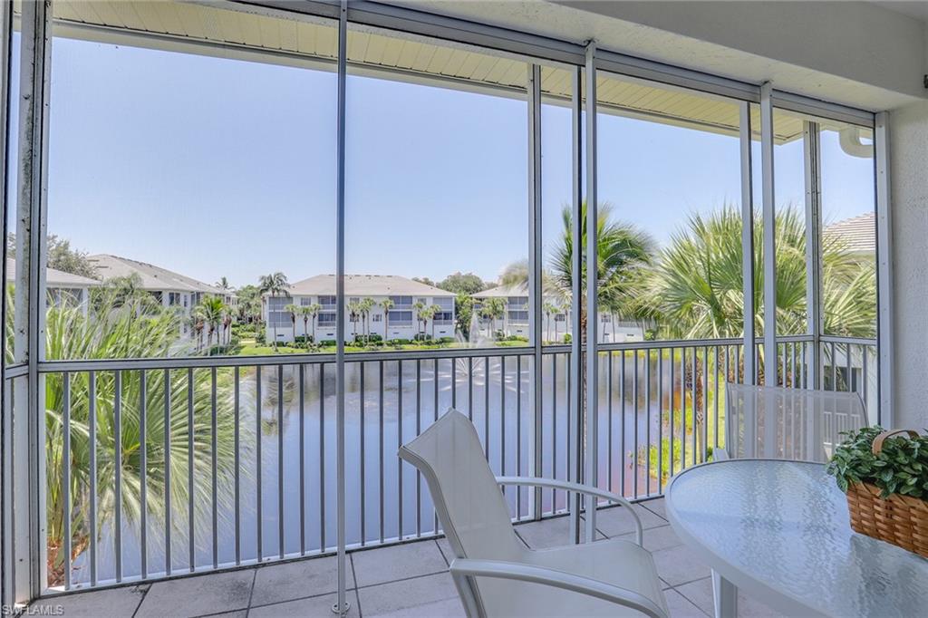 795 Bentwater Circle, Unit 203 Naples, FL 34108 - Photo 19 of 33 a view of a balcony with lake view
