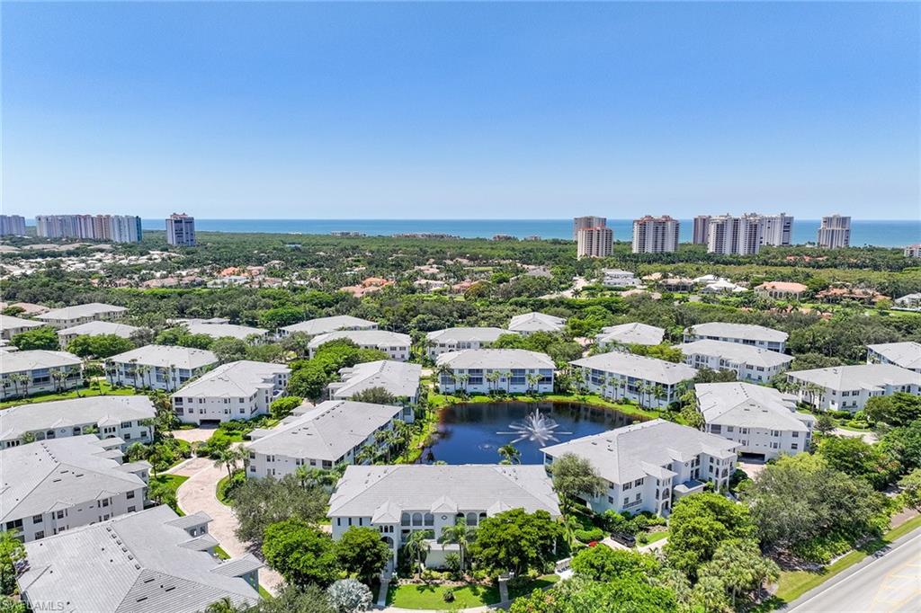 795 Bentwater Circle, Unit 203 Naples, FL 34108 - Photo 22 of 33 an aerial view of a city with lots of residential buildings
