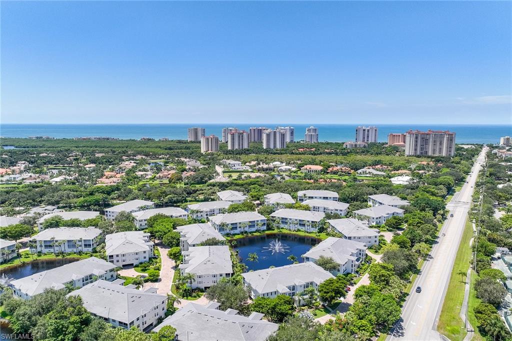 795 Bentwater Circle, Unit 203 Naples, FL 34108 - Photo 23 of 33 an aerial view of a city with lots of residential buildings