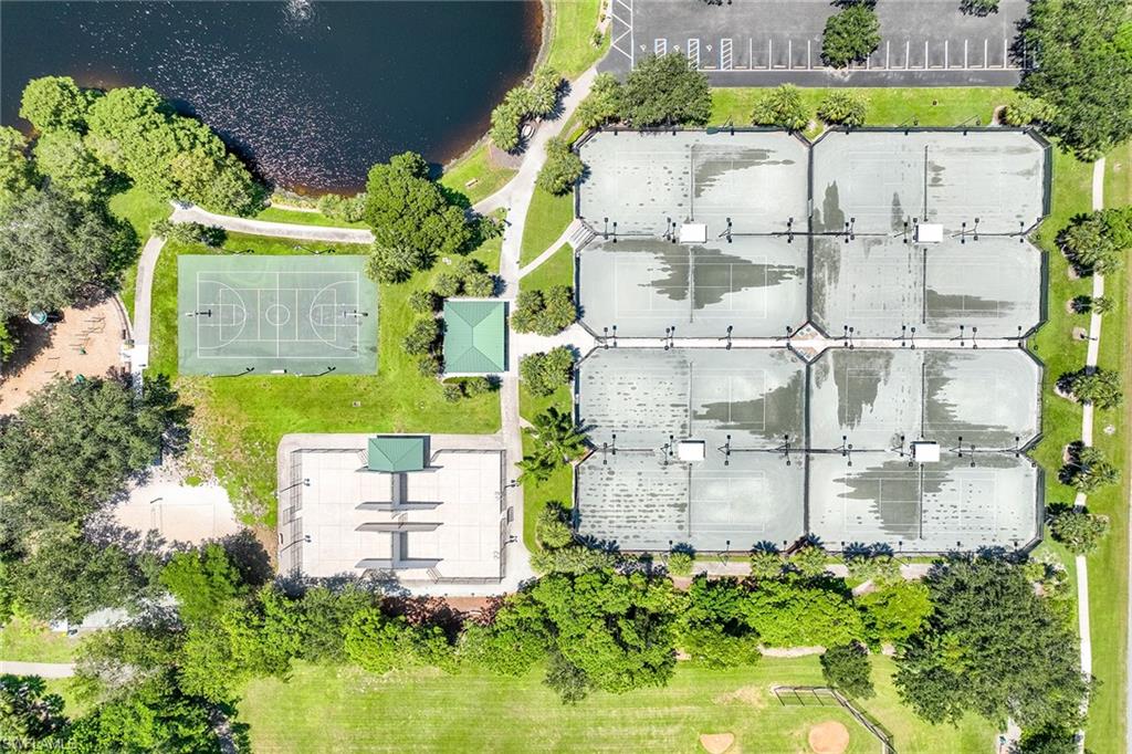 795 Bentwater Circle, Unit 203 Naples, FL 34108 - Photo 25 of 33 a view of a multi story building with a yard