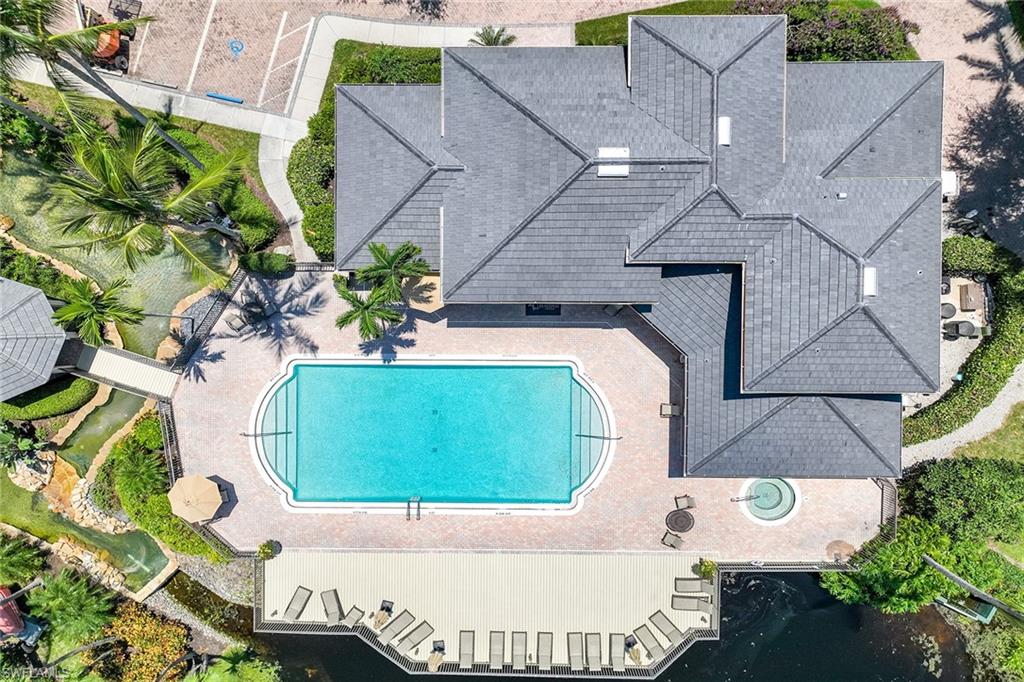 795 Bentwater Circle, Unit 203 Naples, FL 34108 - Photo 27 of 33 an aerial view of a house with a yard